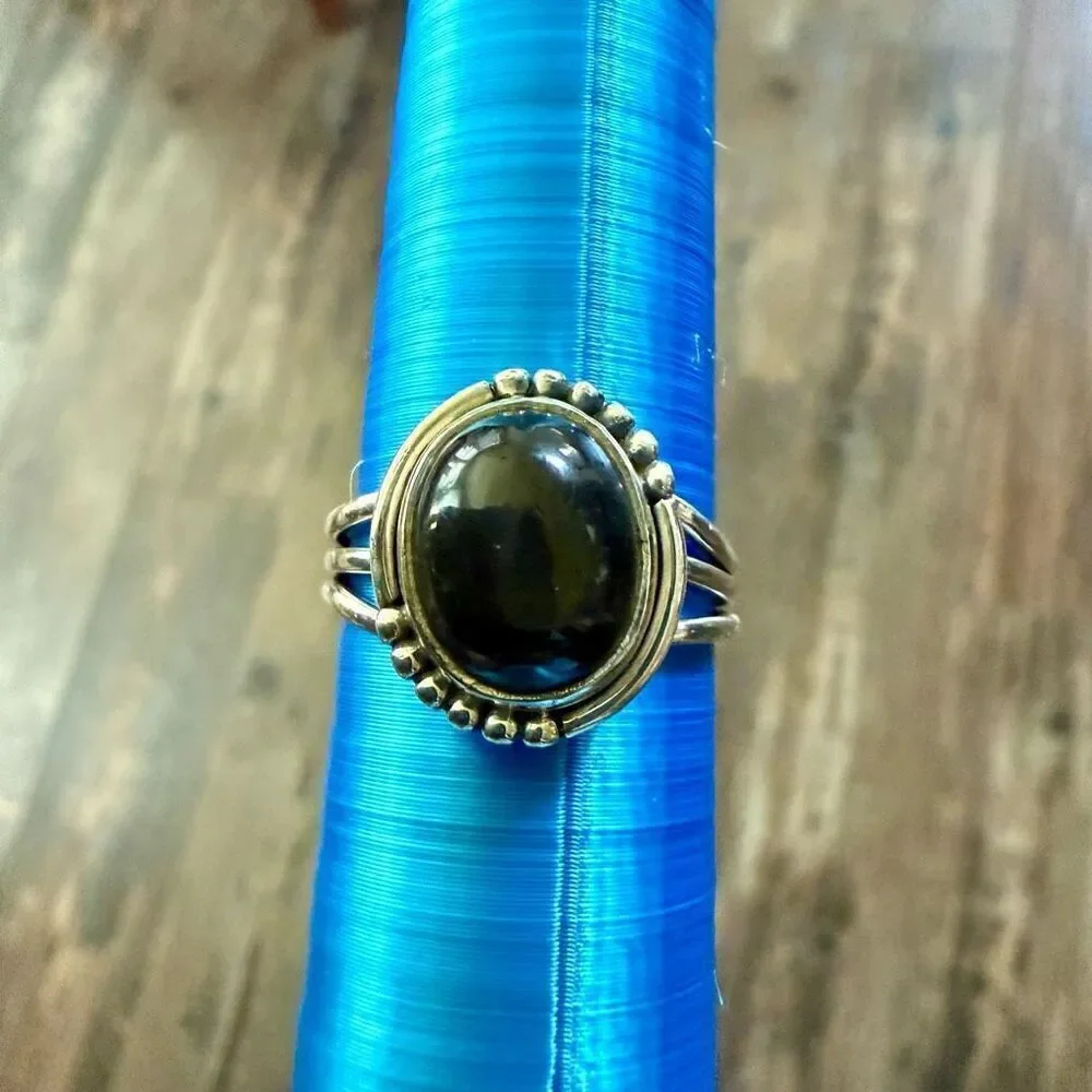 Bold Elegance: Handcrafted Sterling Silver Ring with Oval Black Star Diopside